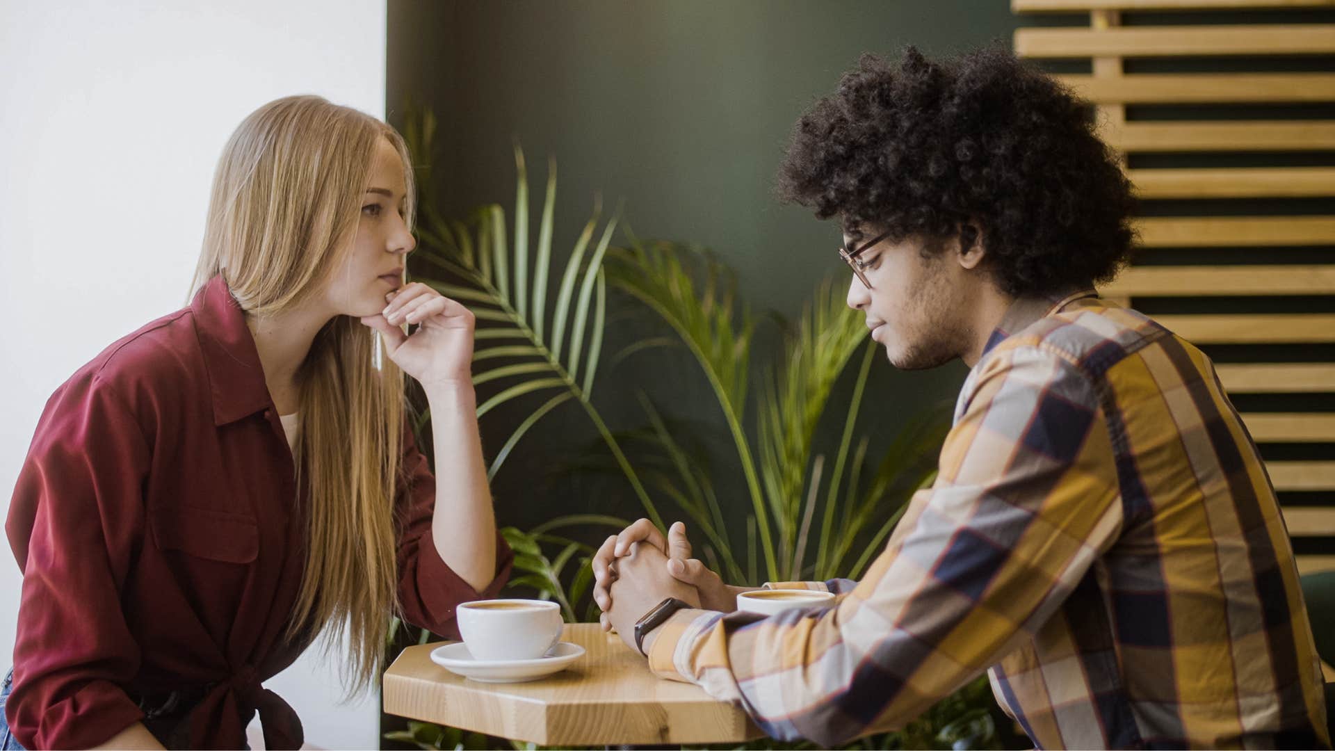 Couple having a serious conversation in a coffee shop