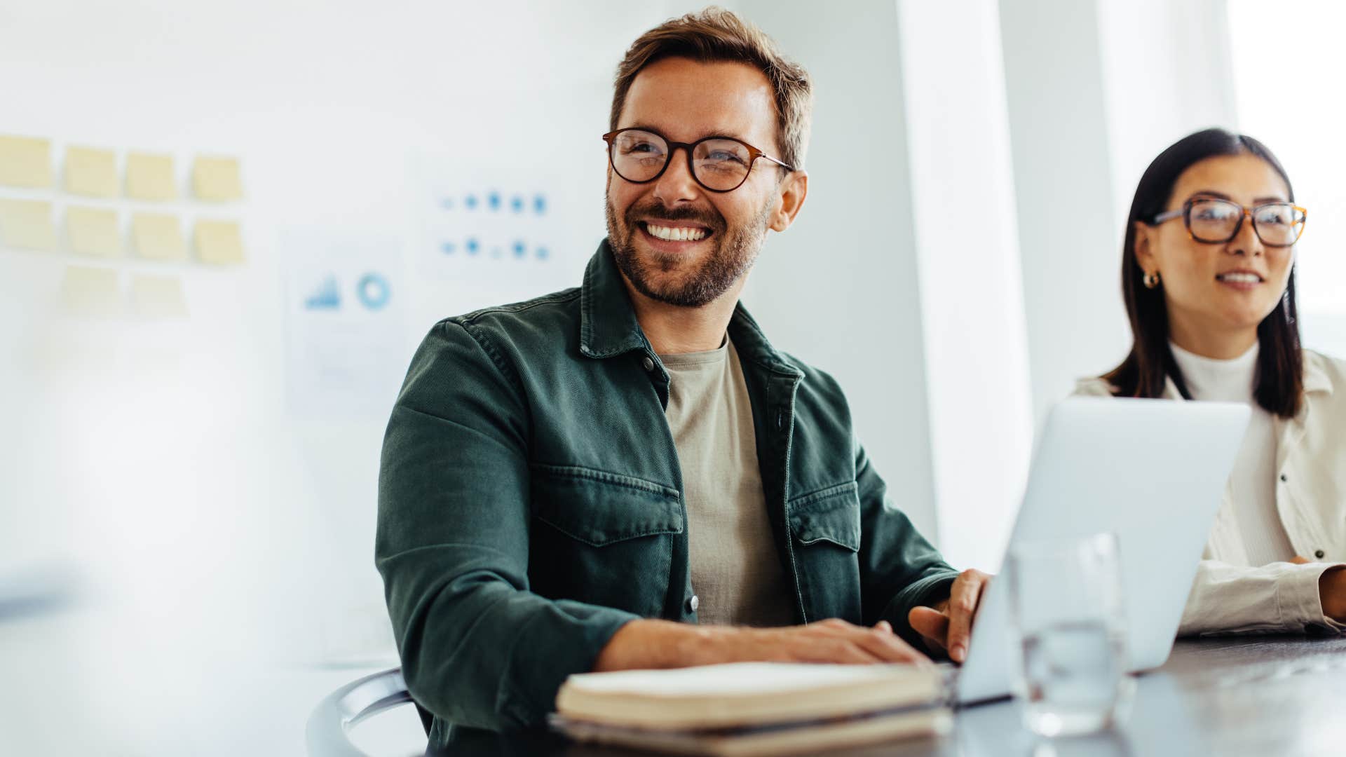 Professional man laughing during a work meeting