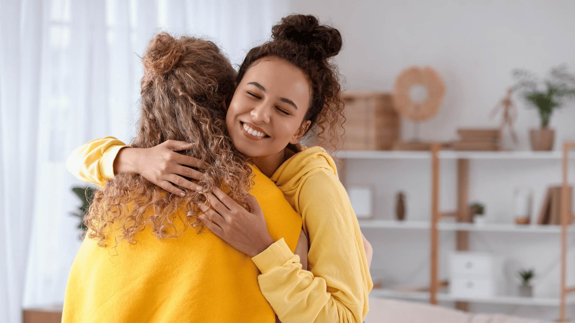 woman hugging her friend