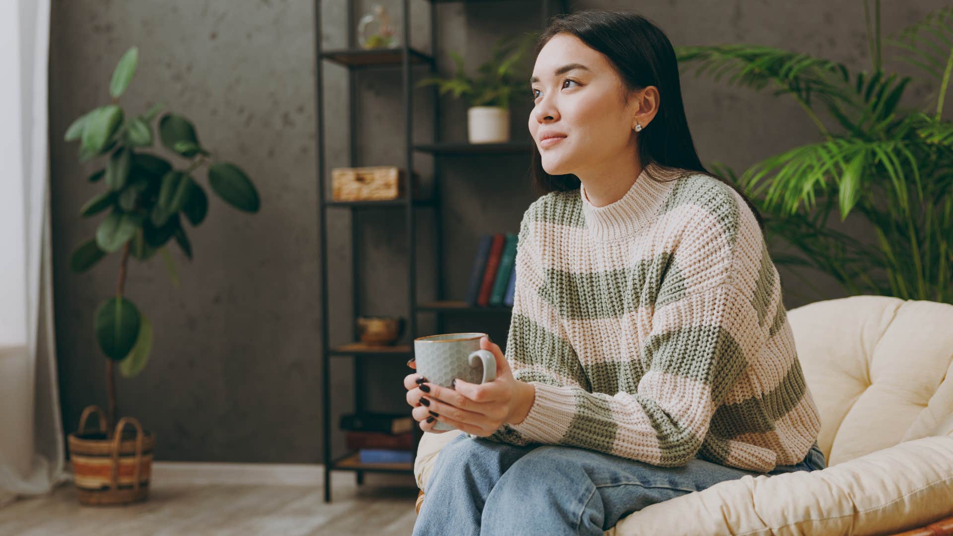 Woman smiling and drinking coffee. 