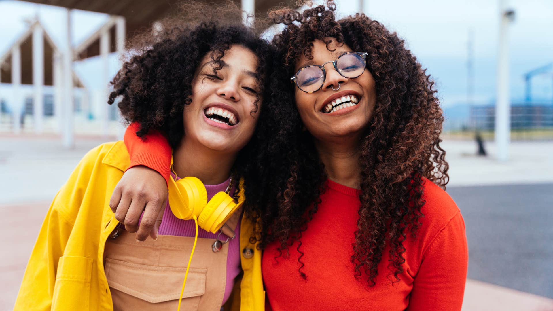 Woman hugging her friend and smiling