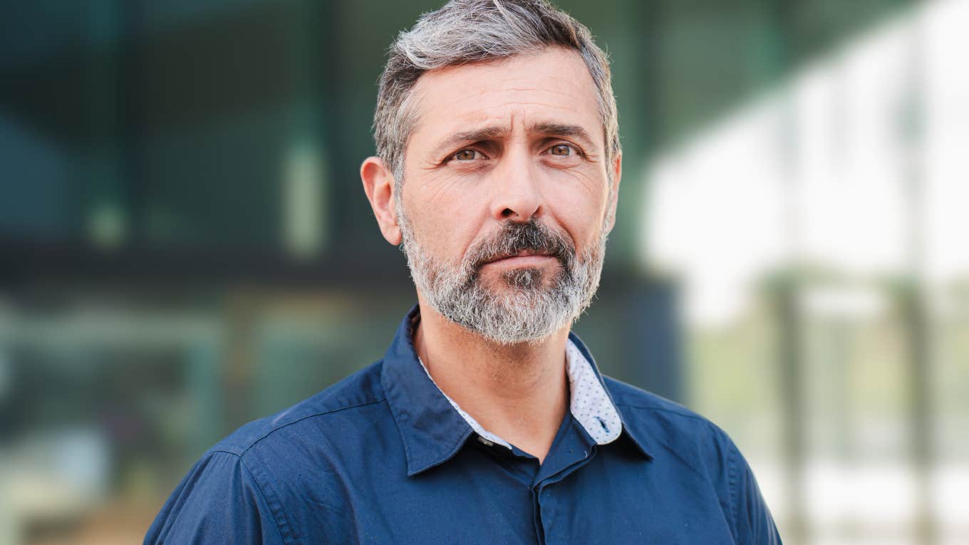 Adult man looking sad staring at the camera.