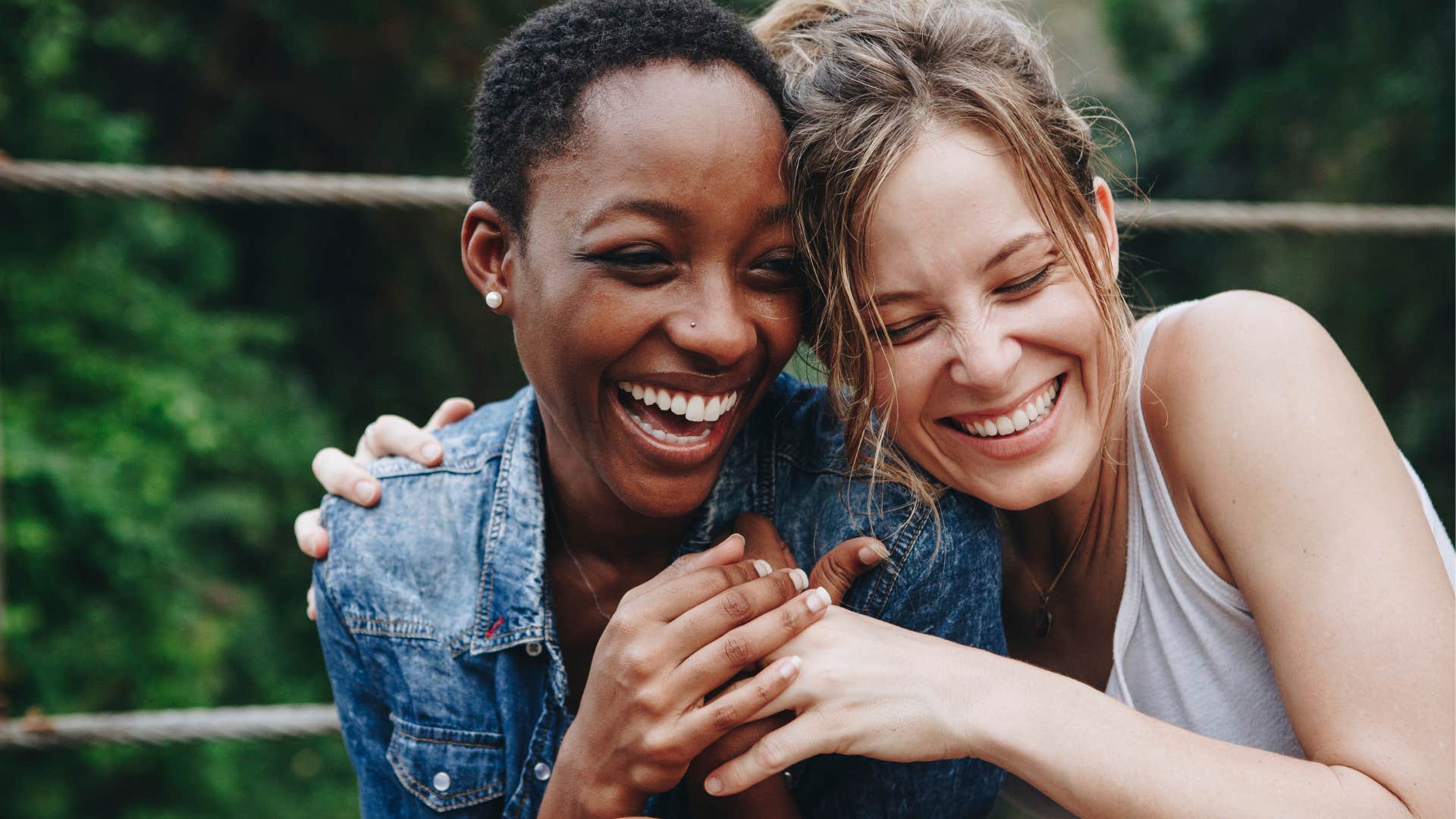 Two women hugging and laughing together