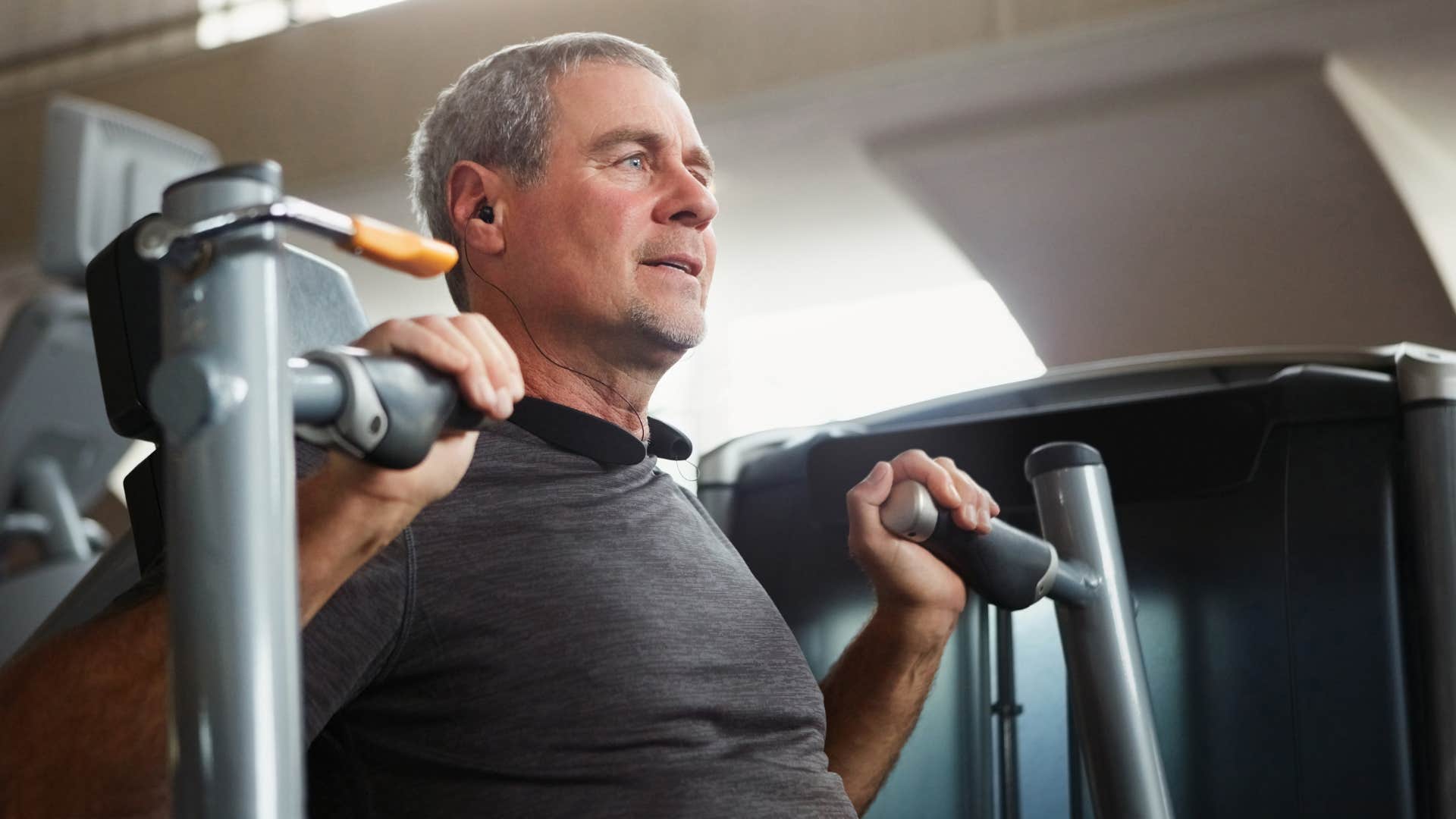 Older man working out in a gym