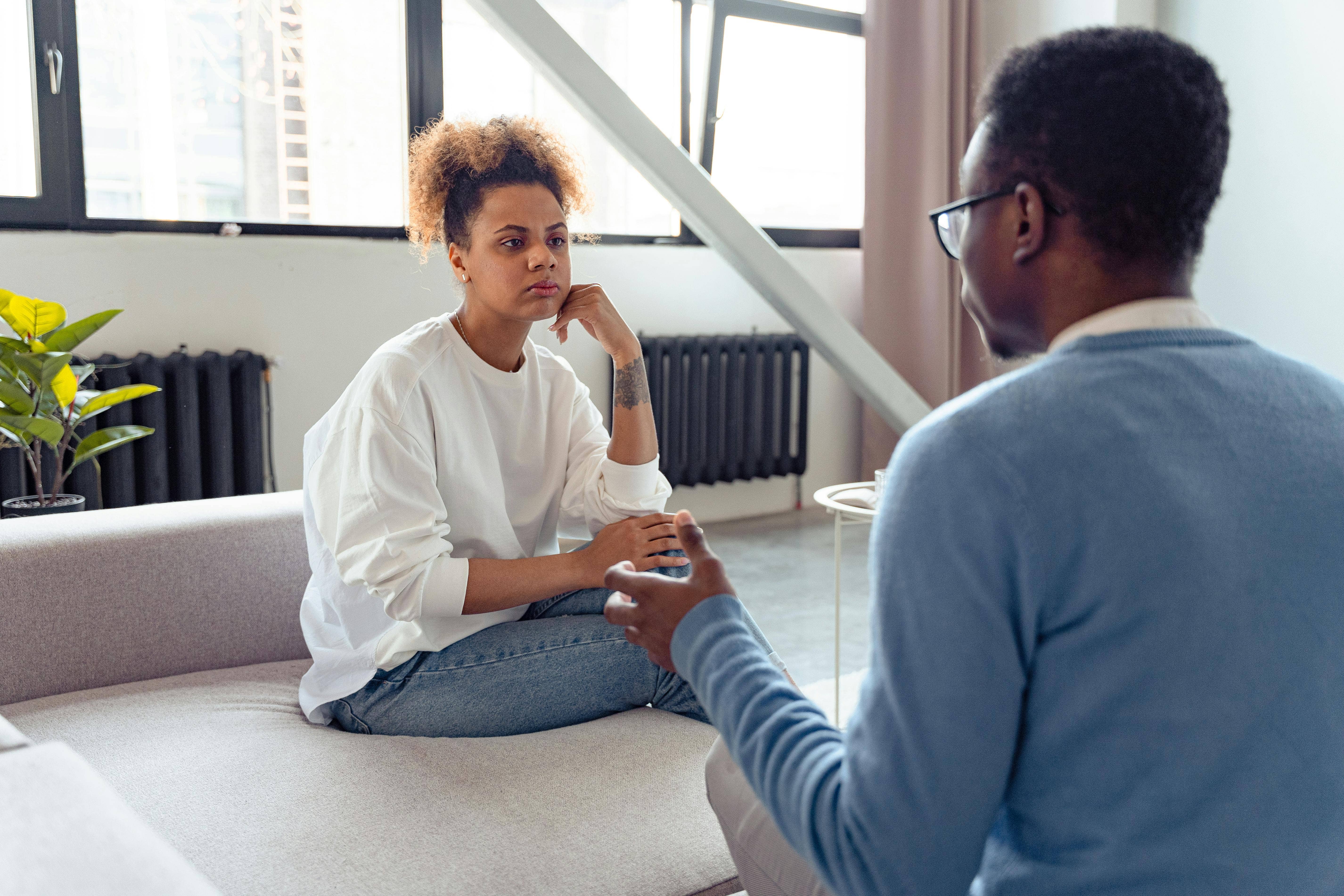 couple arguing on couch