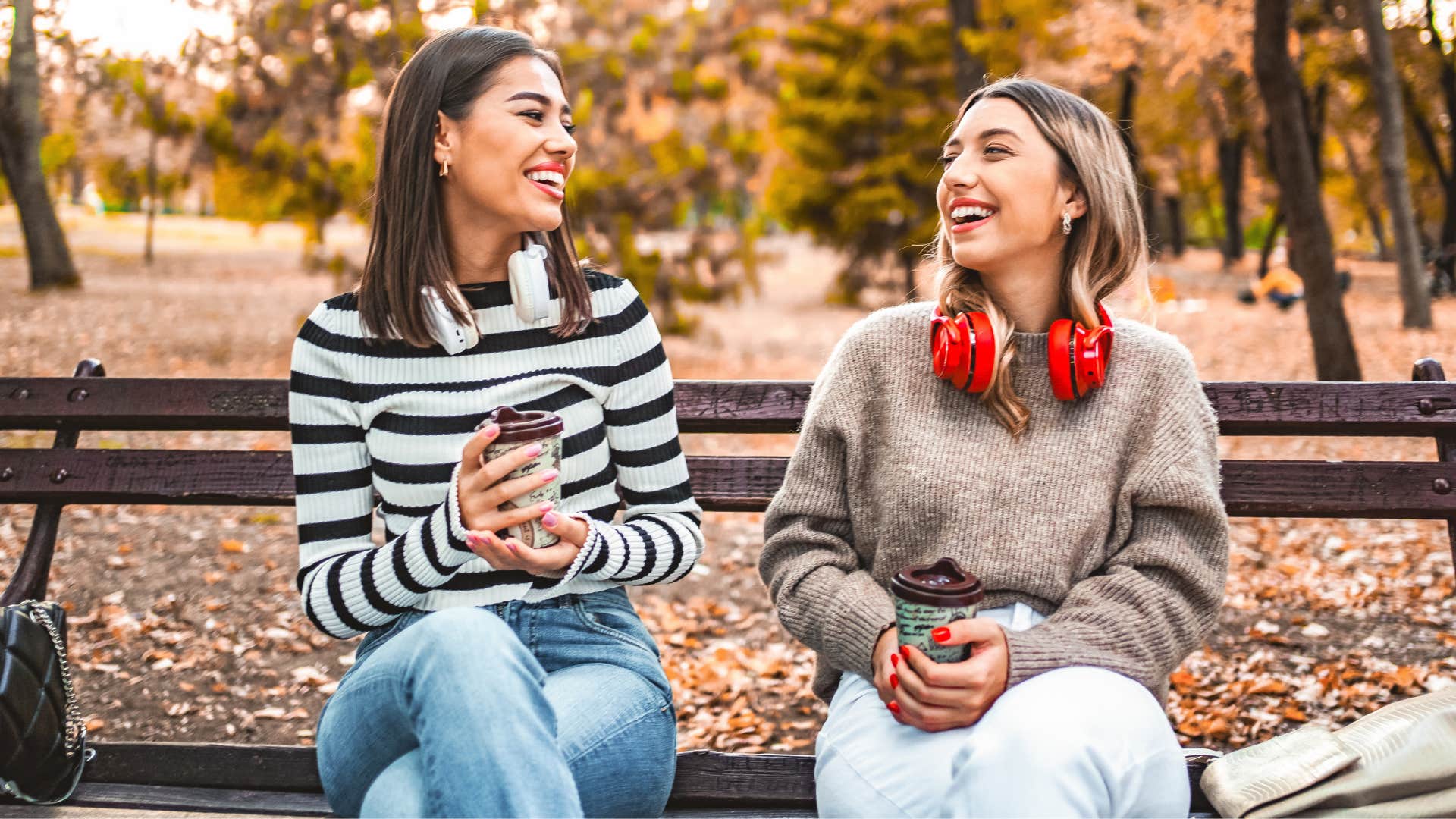 Two women smiling and laughing together.