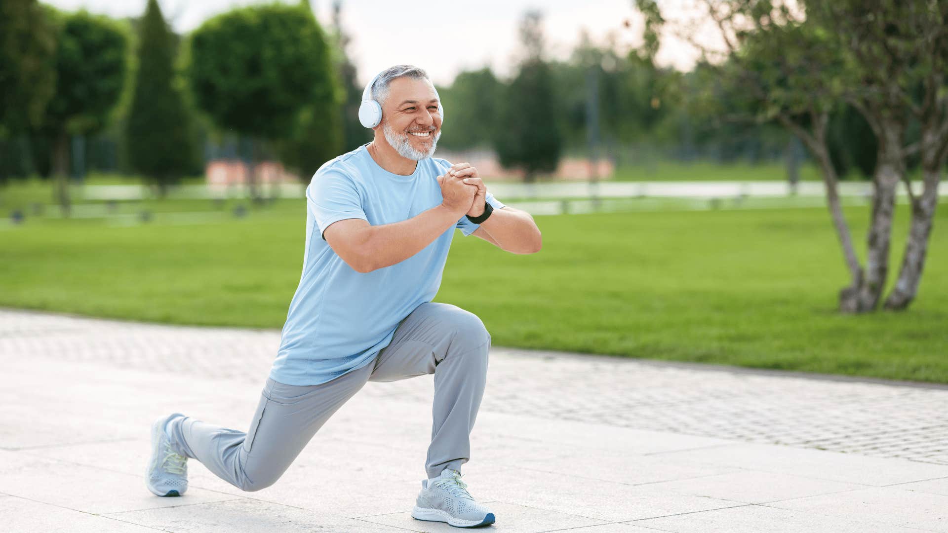 older man stretching before run