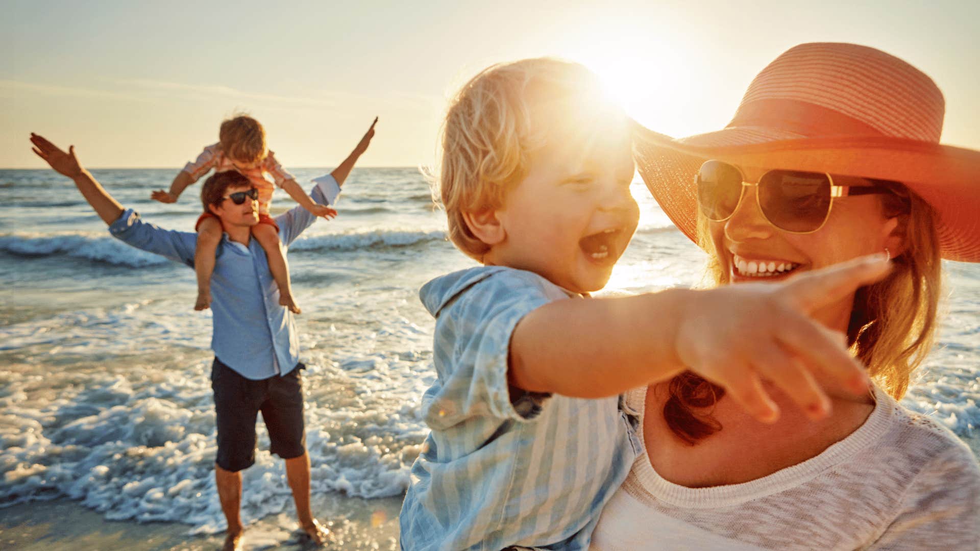 Family on sunny beach don't want to break up