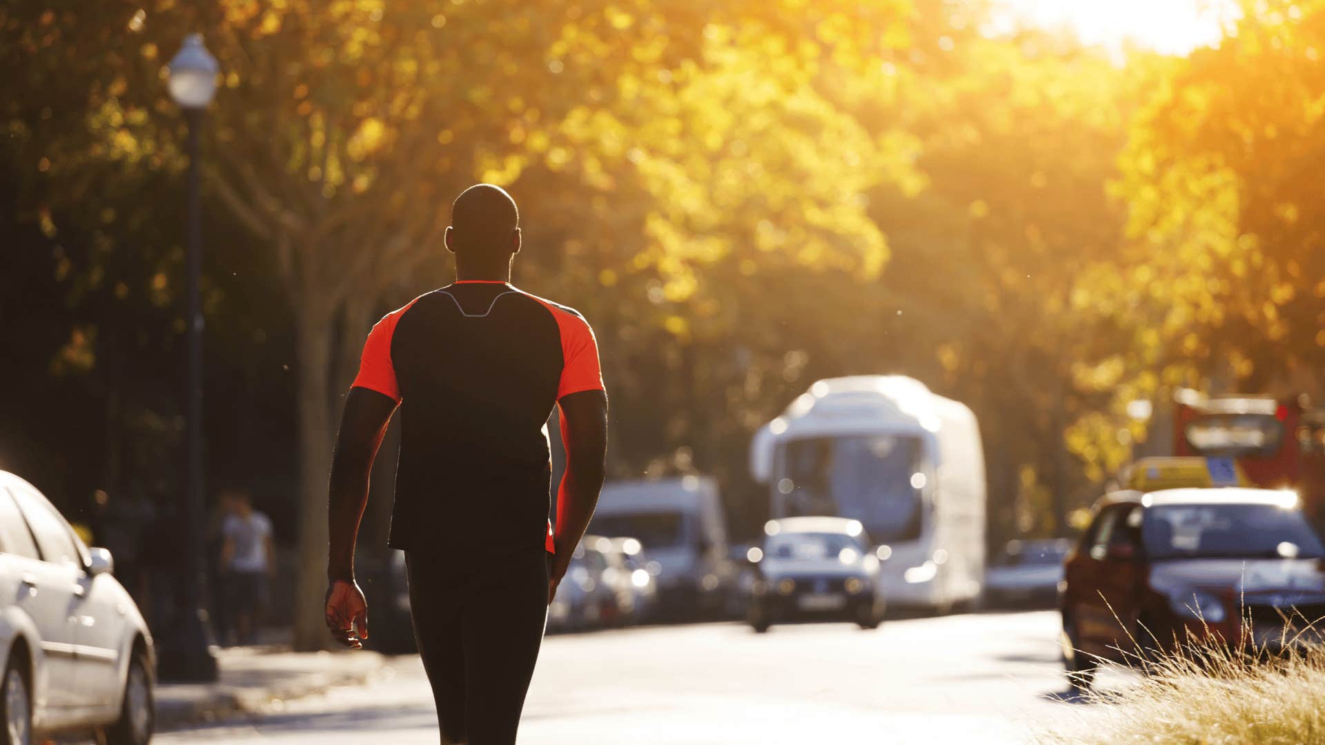 man walking down street