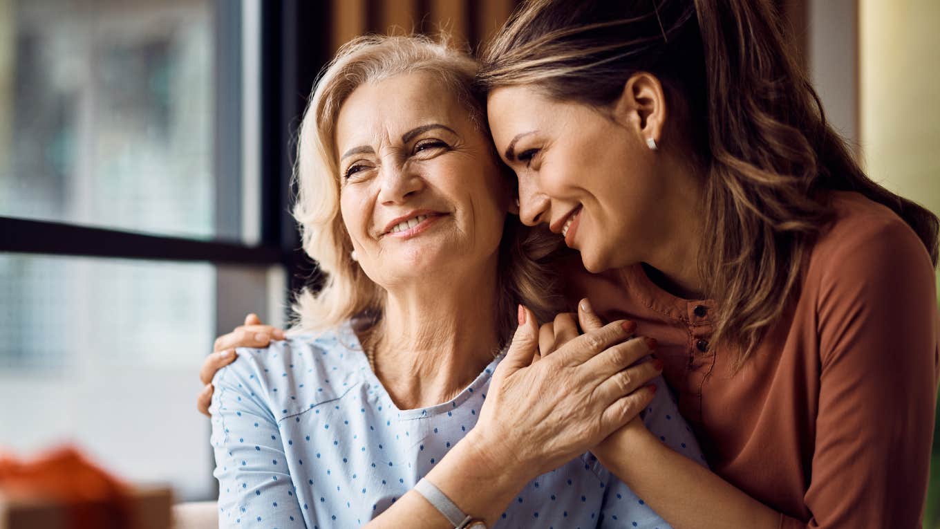 adult daughter hugging her mom