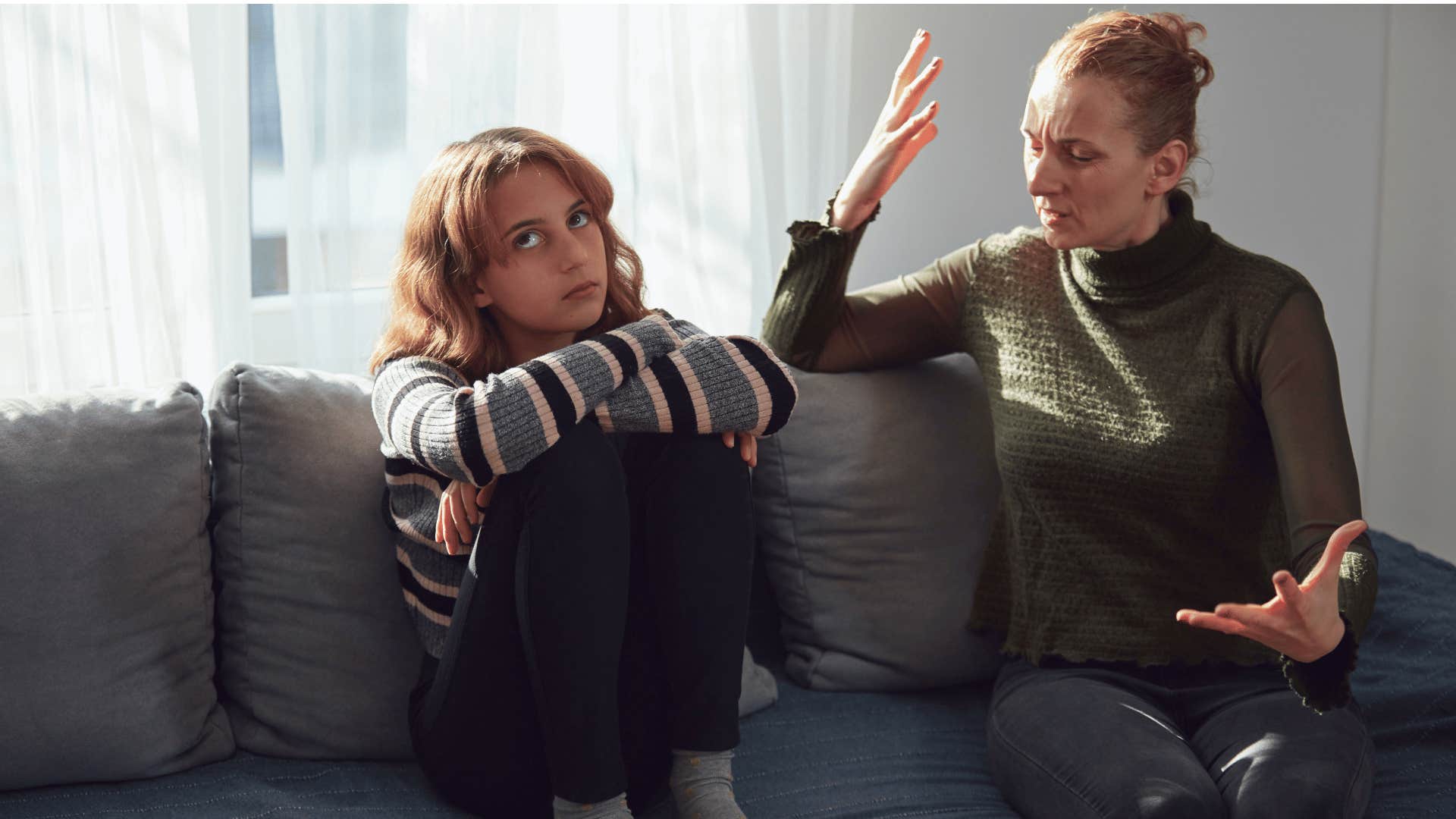 mother talking her daughter while frustrated 