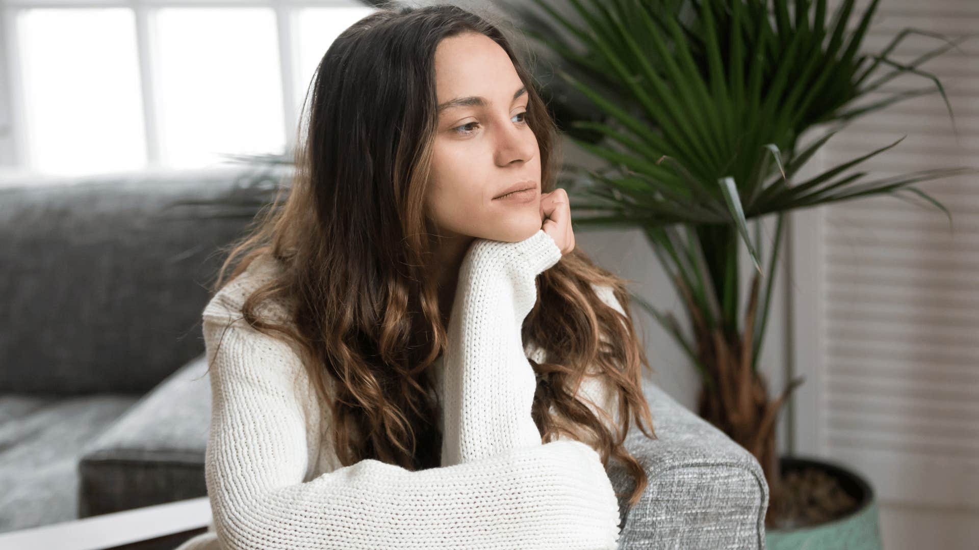 woman staring out the window