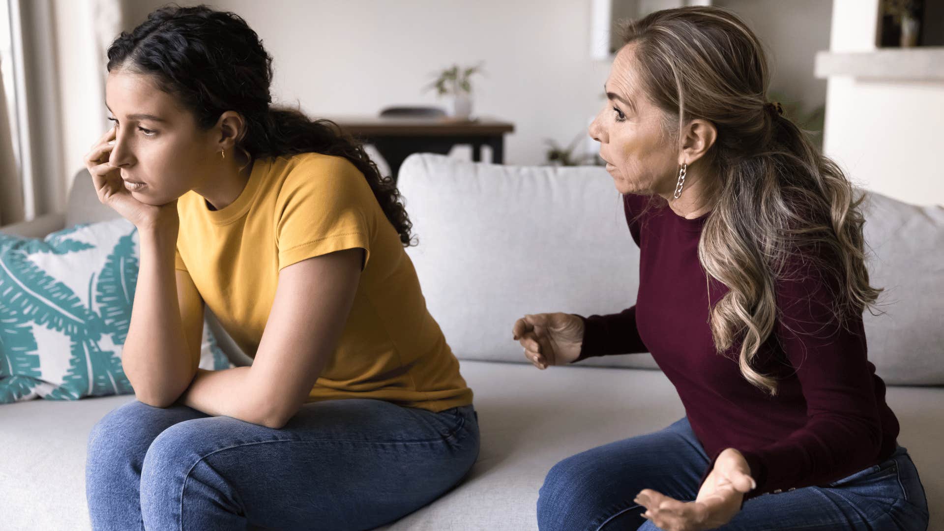 mother yelling at daughter while daughter ignores her