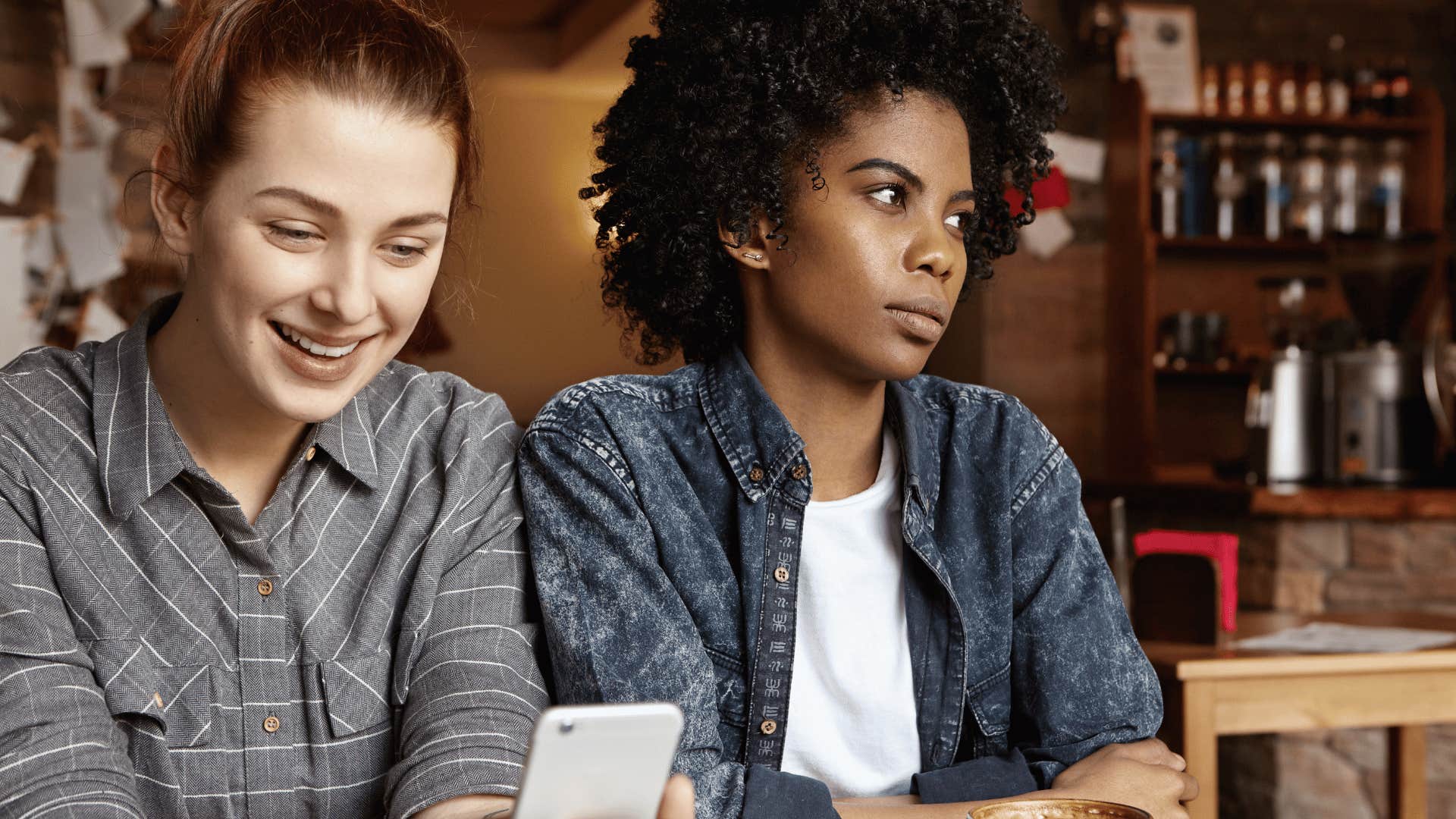 women looking at a phone