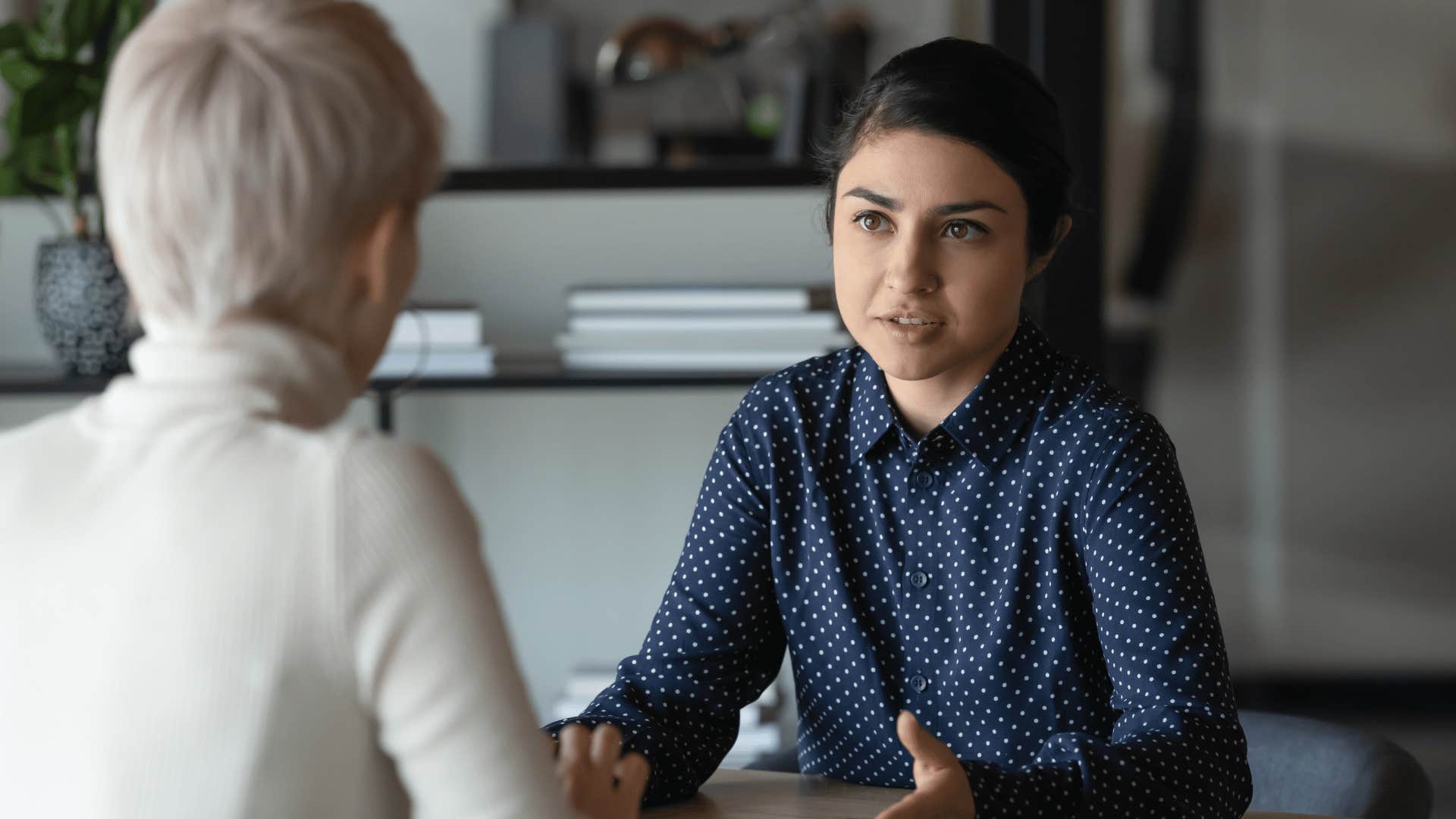 woman talking seriously with older woman