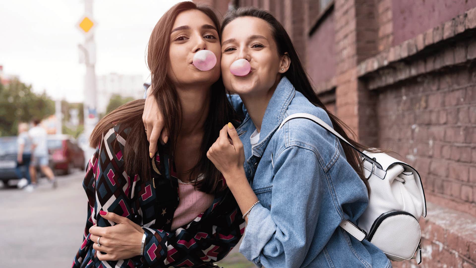 two women blowing gum