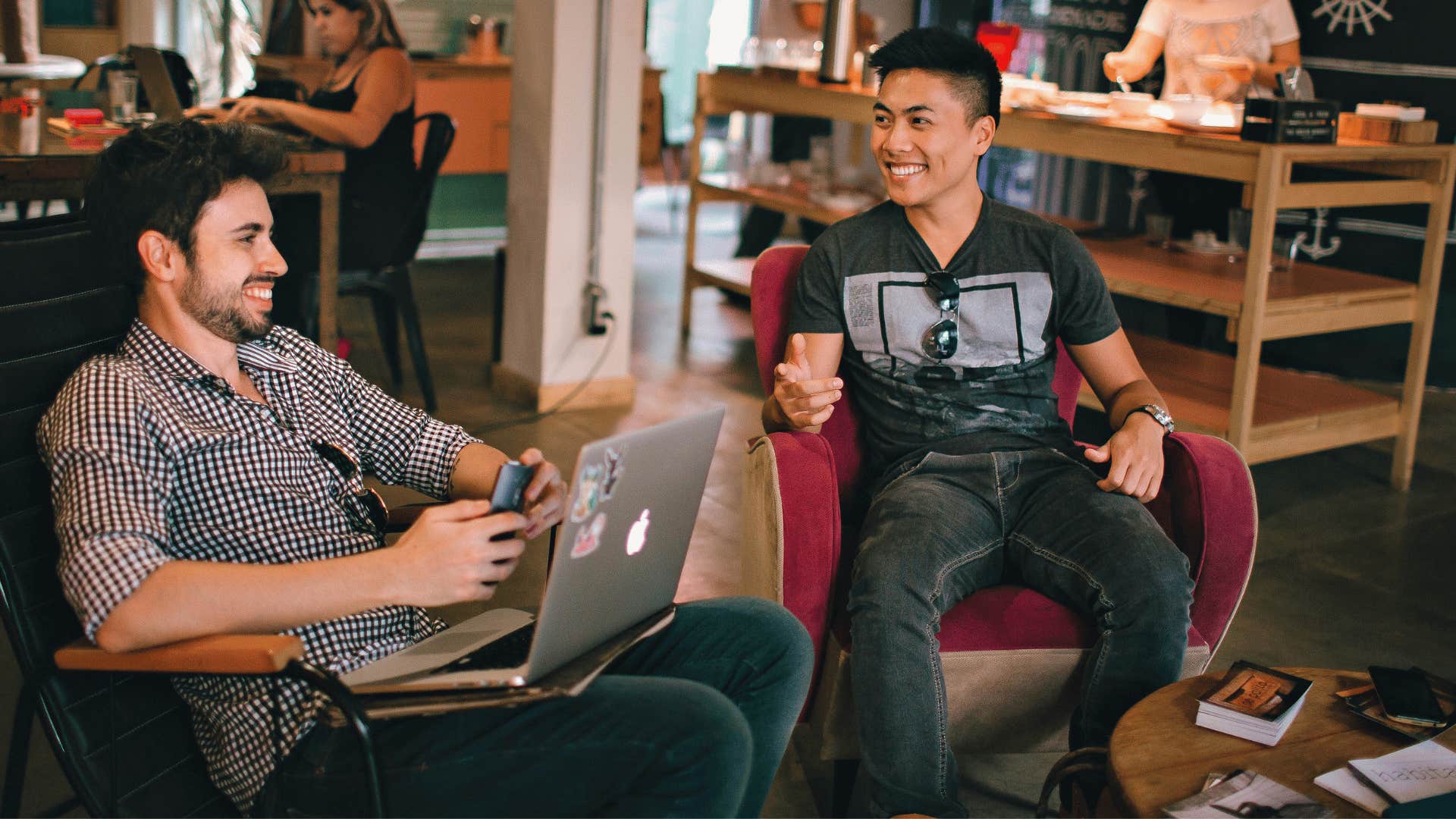 two men chatting on the couch