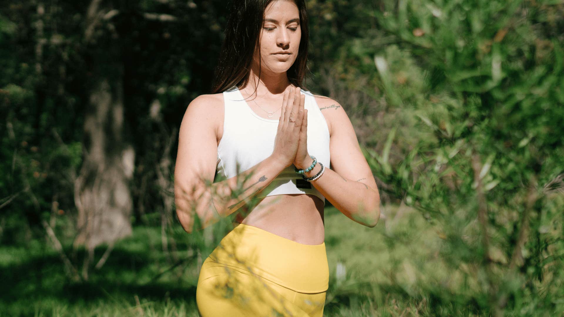 woman doing yoga outside