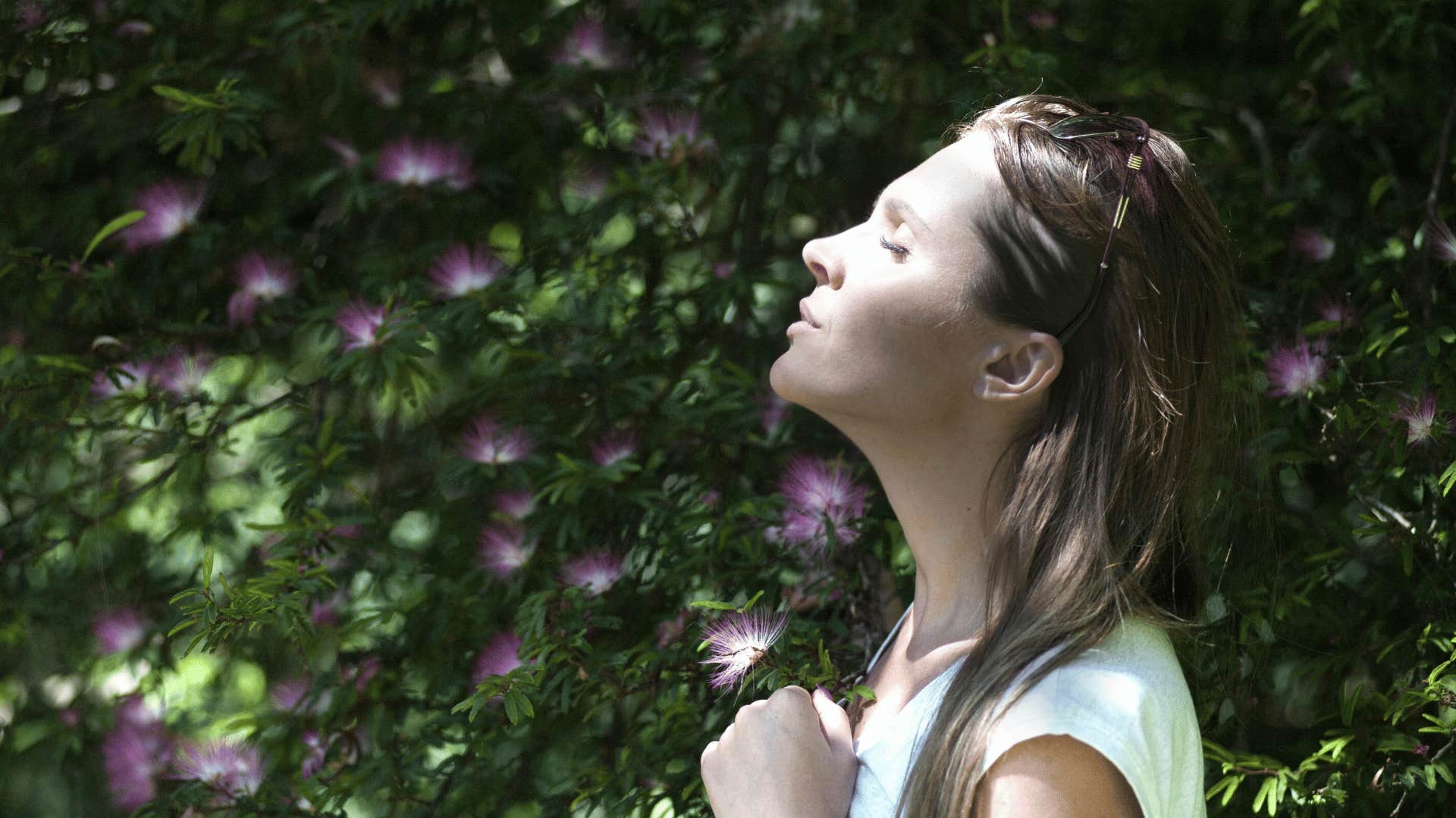 woman standing in sunlight