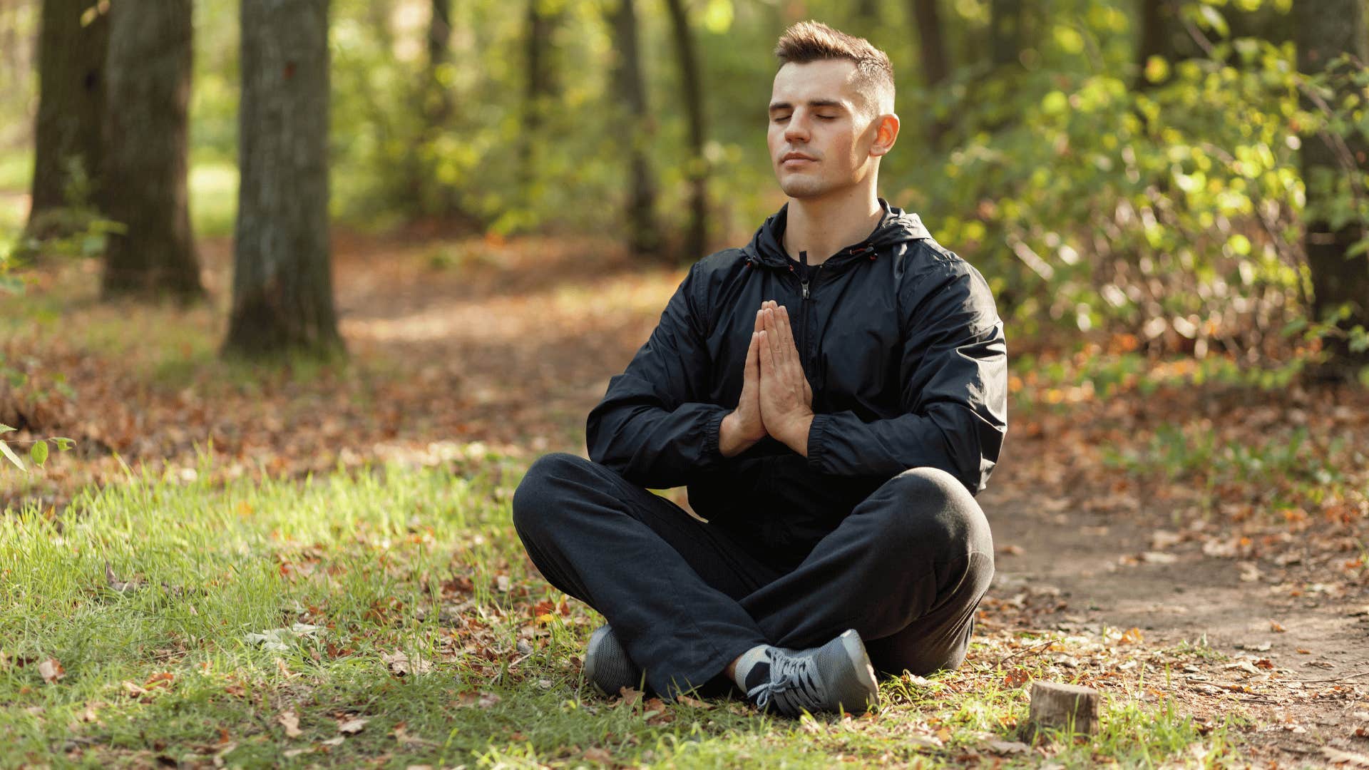 man meditating outside