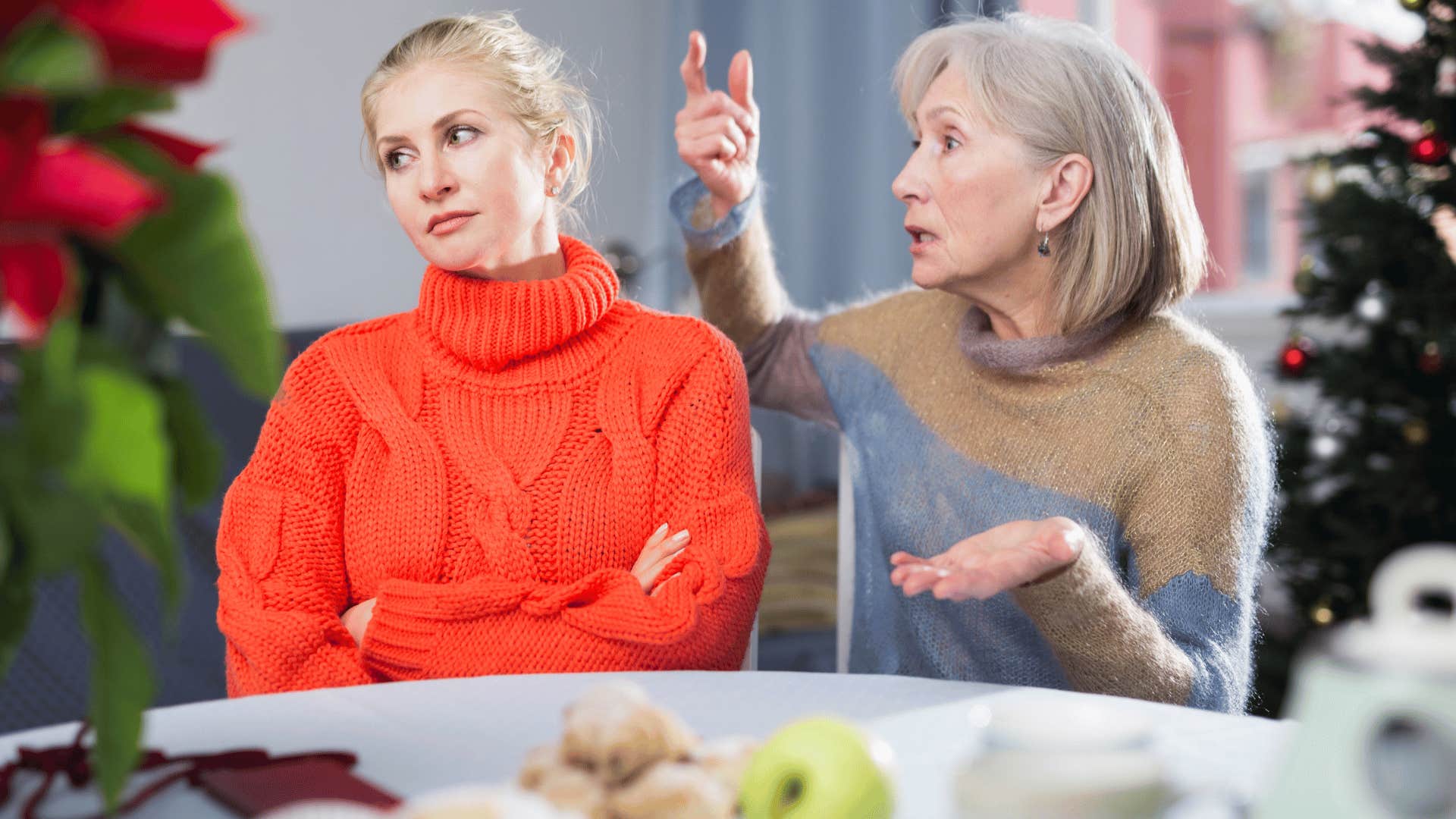 woman crossing arms and ignoring upset woman