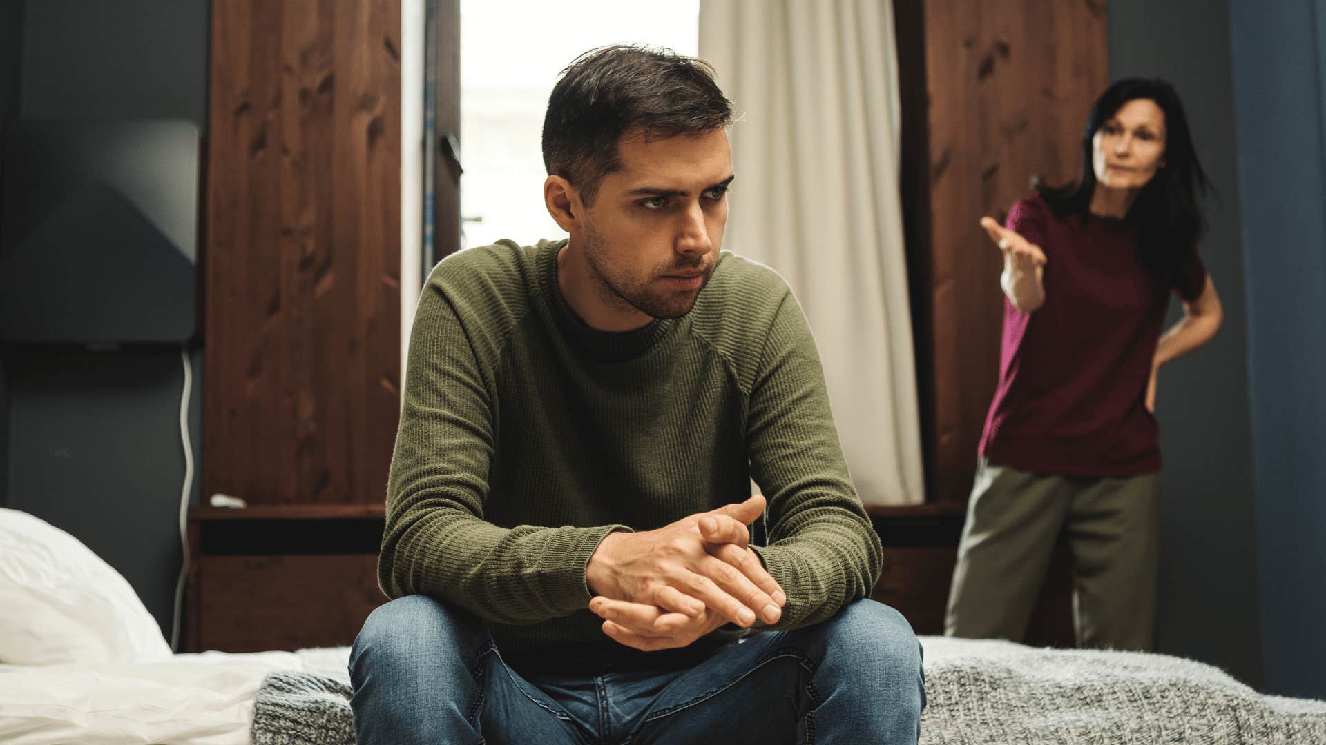 man ignoring angry woman