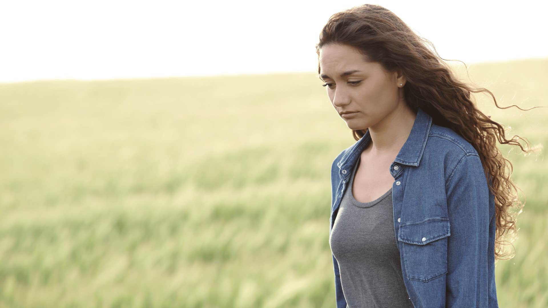 woman walking while looking down