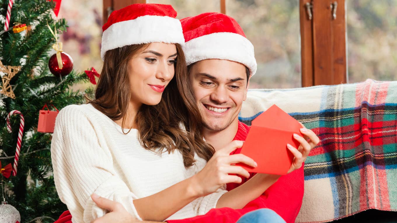 Husband and wife reading a holiday card