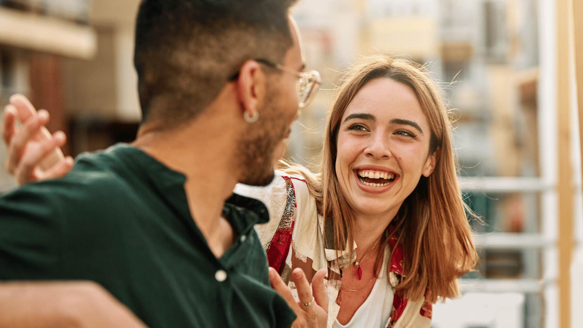 Happy woman talks to man to connect with his love langauge