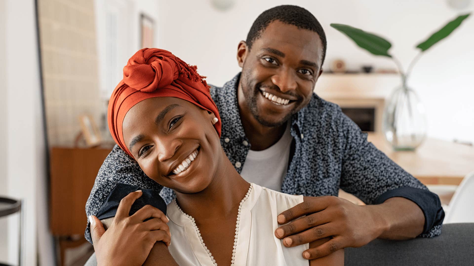 Happy man embraces encouraging woman 