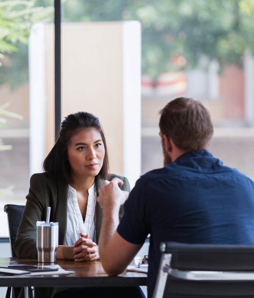 woman listening to friend in coffee shop