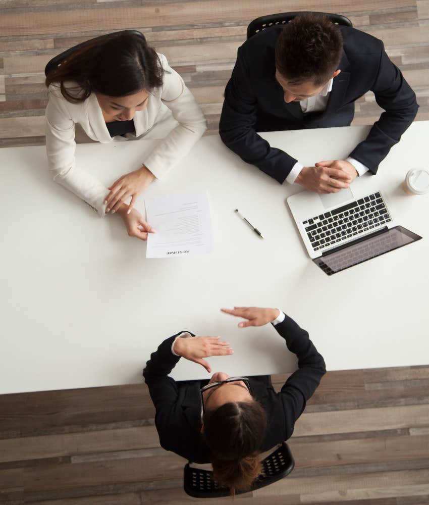 woman in a job interview with two hiring managers