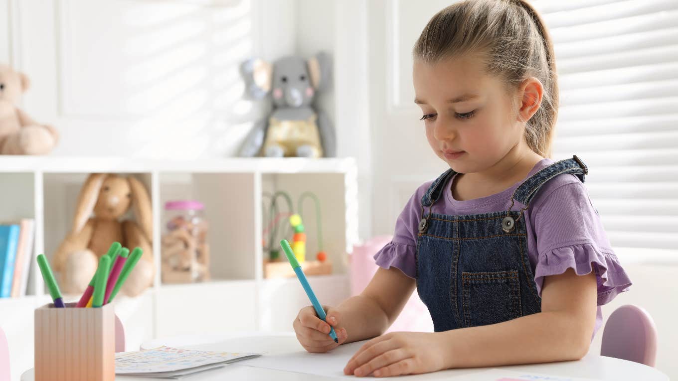 Goddaughter writing thank you card