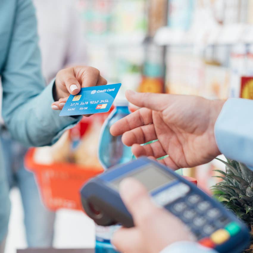 Woman paying with her credit card