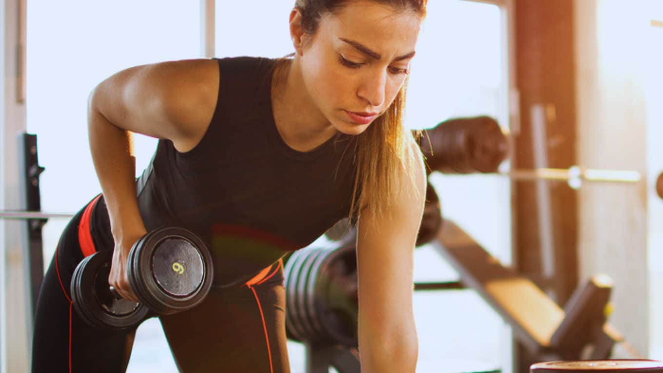 woman working out with weights 