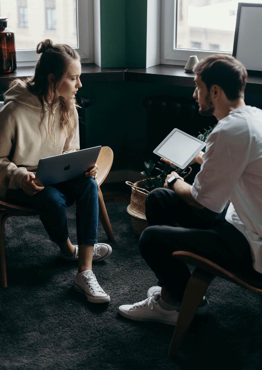 young man and woman working together