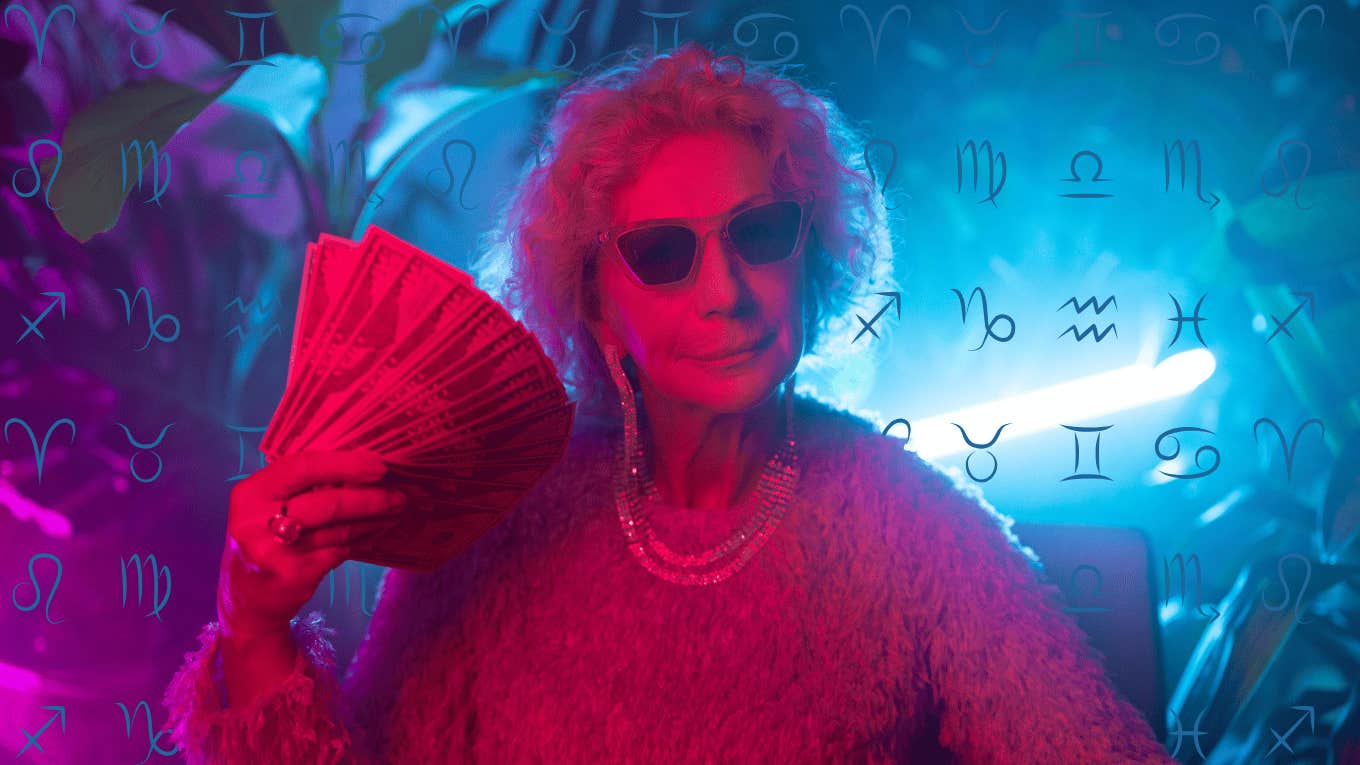 cool older woman holding money with zodiac signs financial luck december 2024