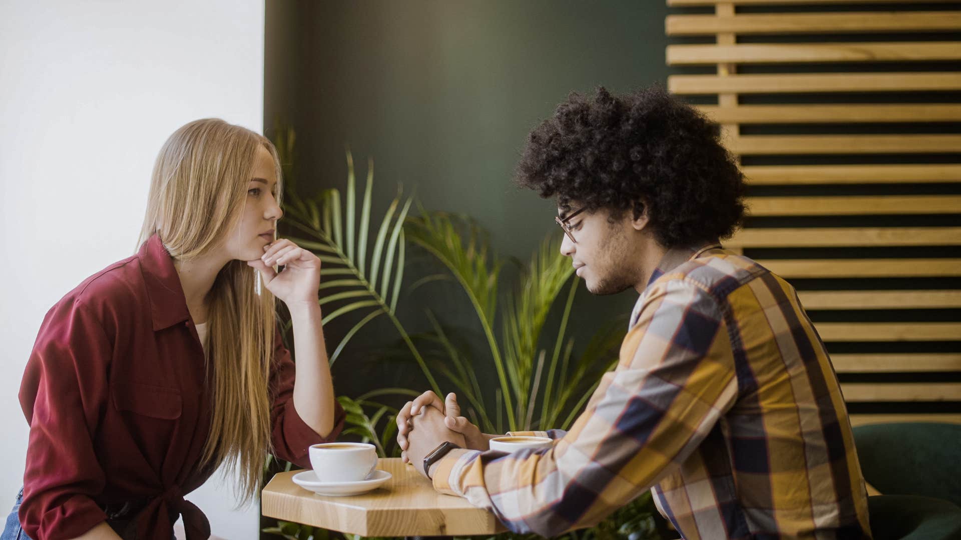 man and woman sitting in silence