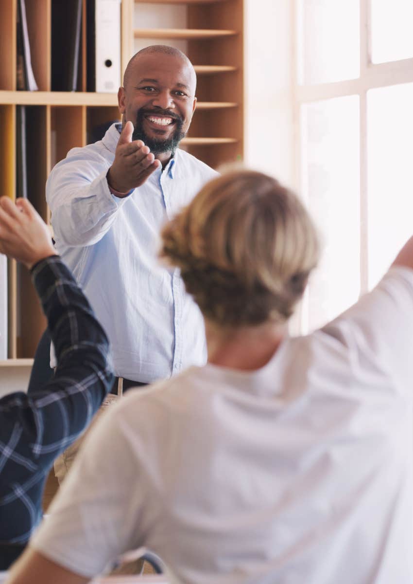  man and student hands and question in classroom for teaching