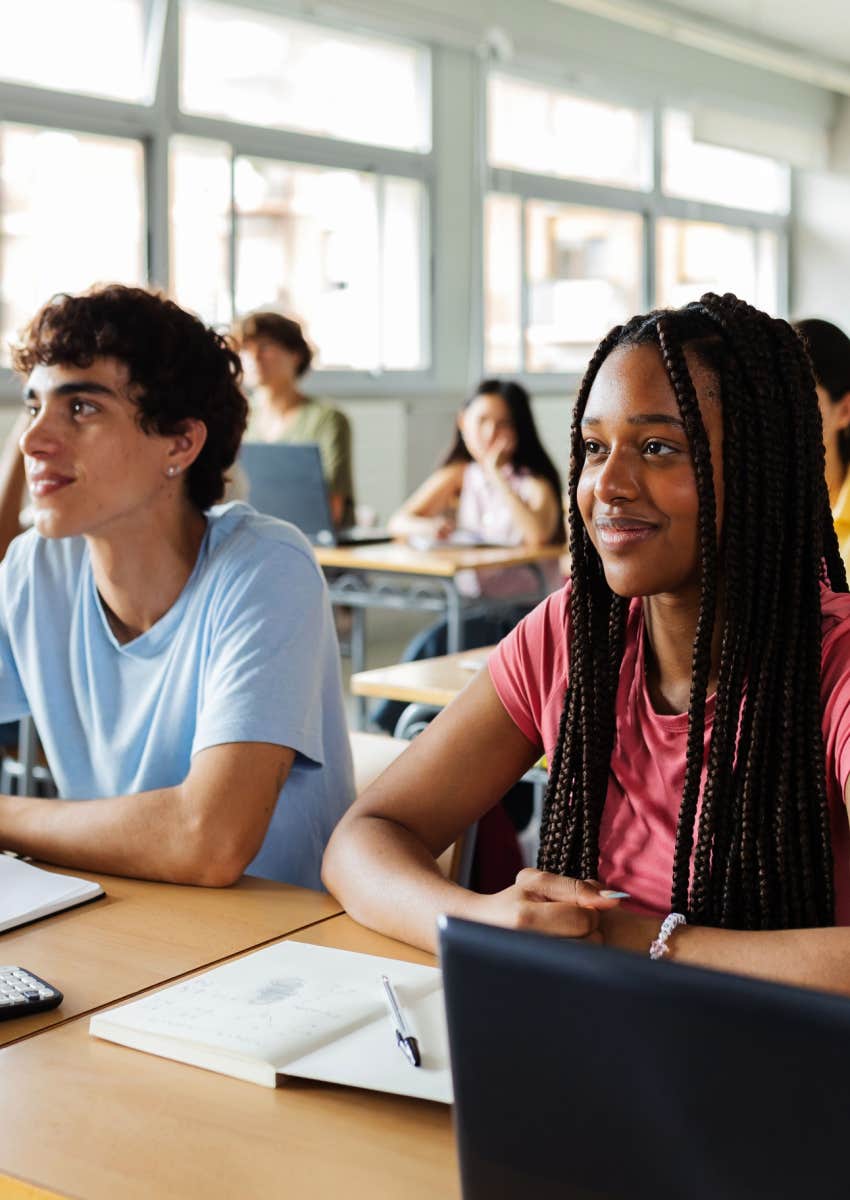 Students listening to teacher in classroom