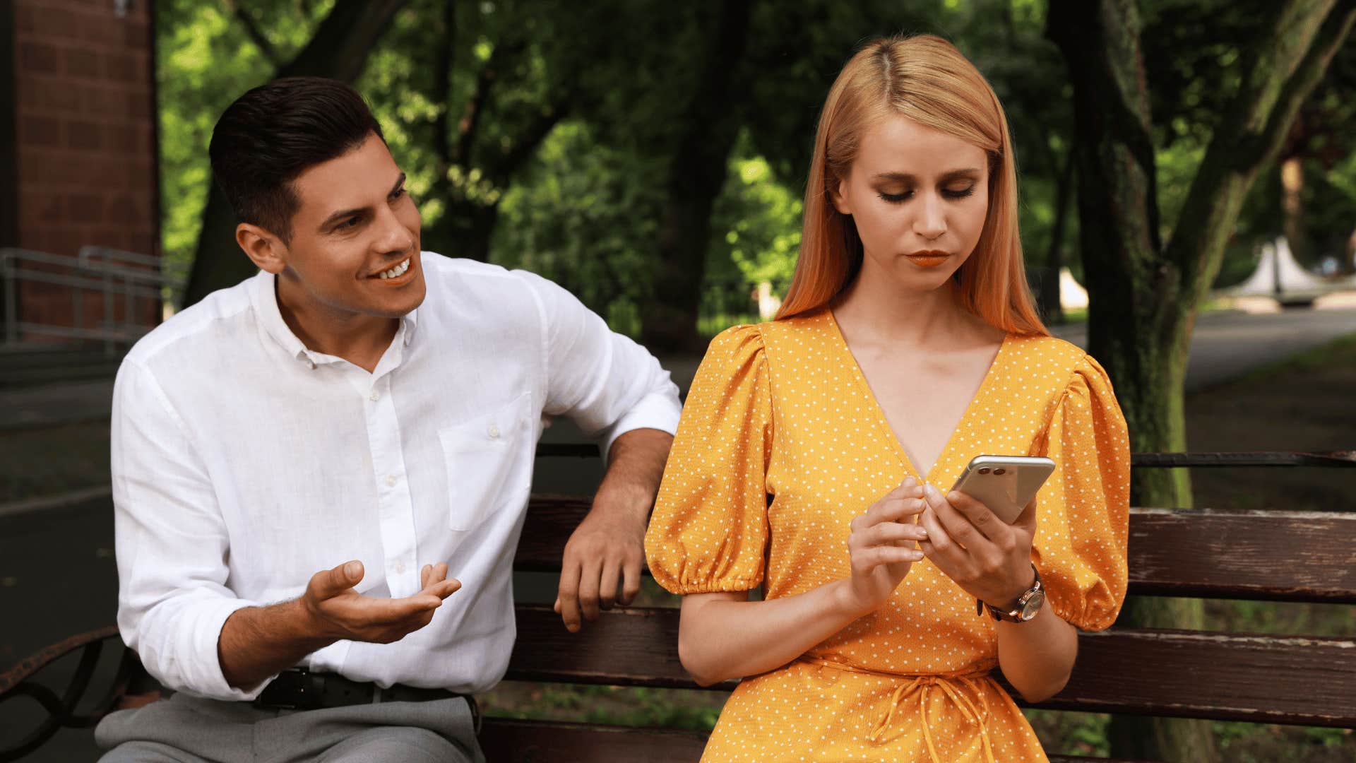 woman ignoring man trying to offer assurance