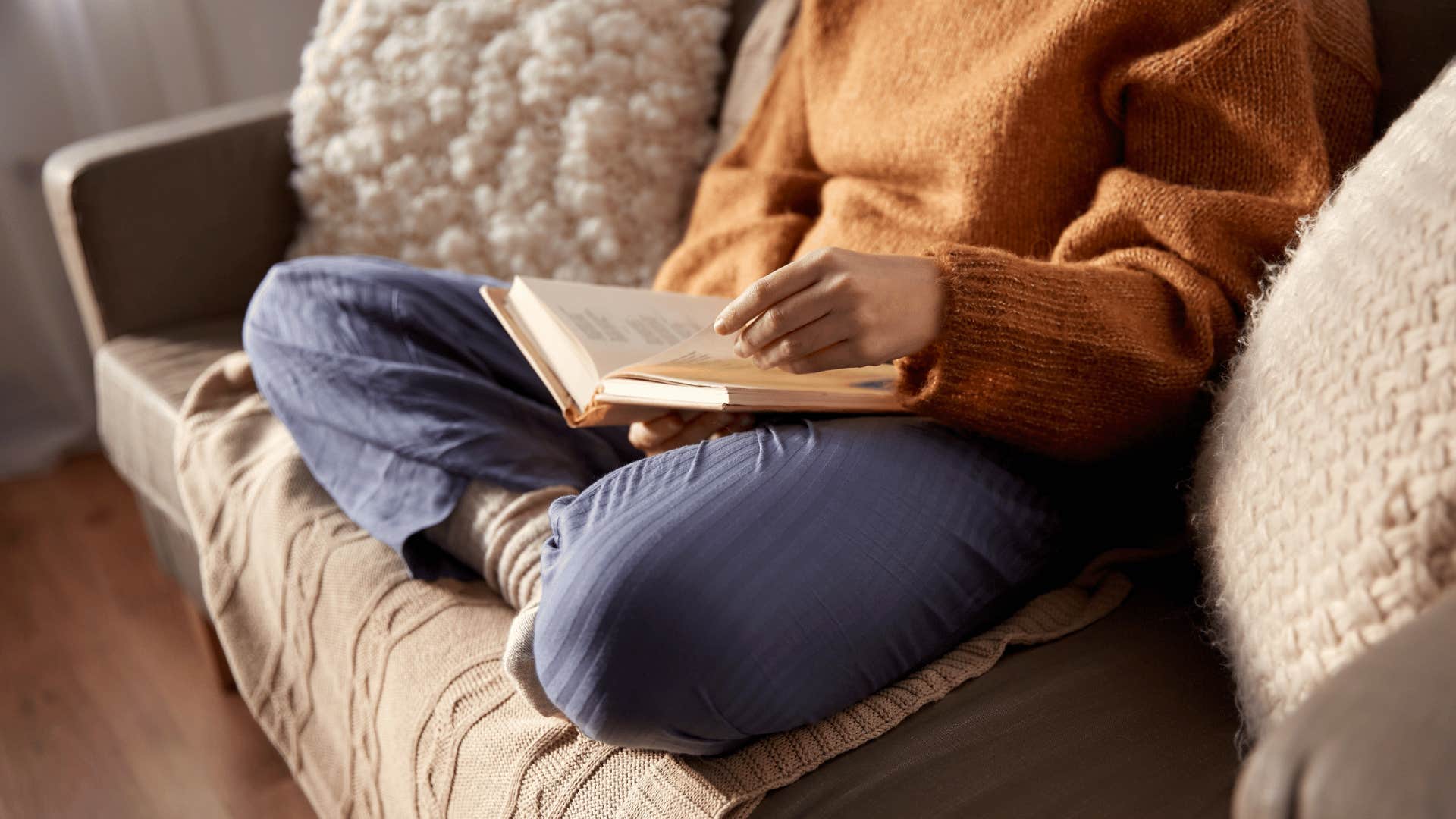 person reading on couch