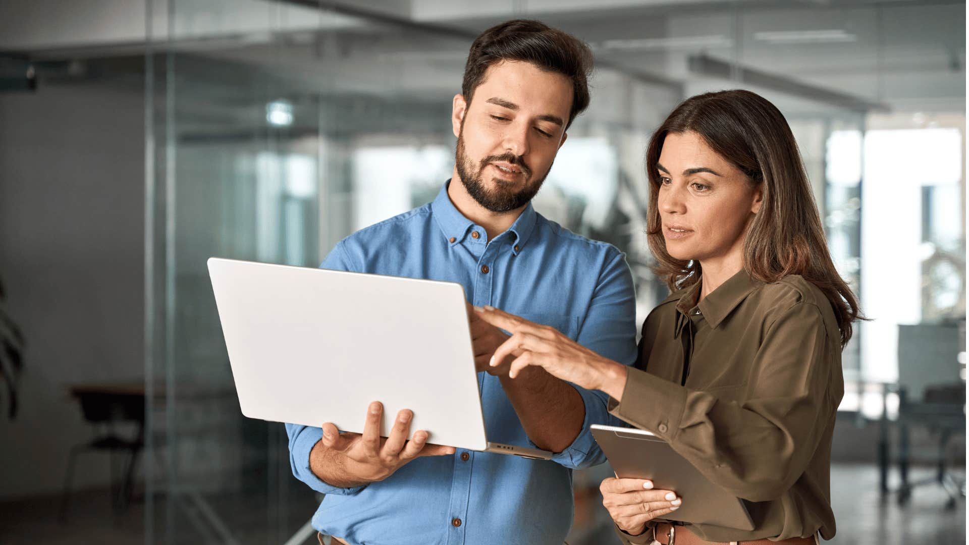 coworkers talking in front of computer