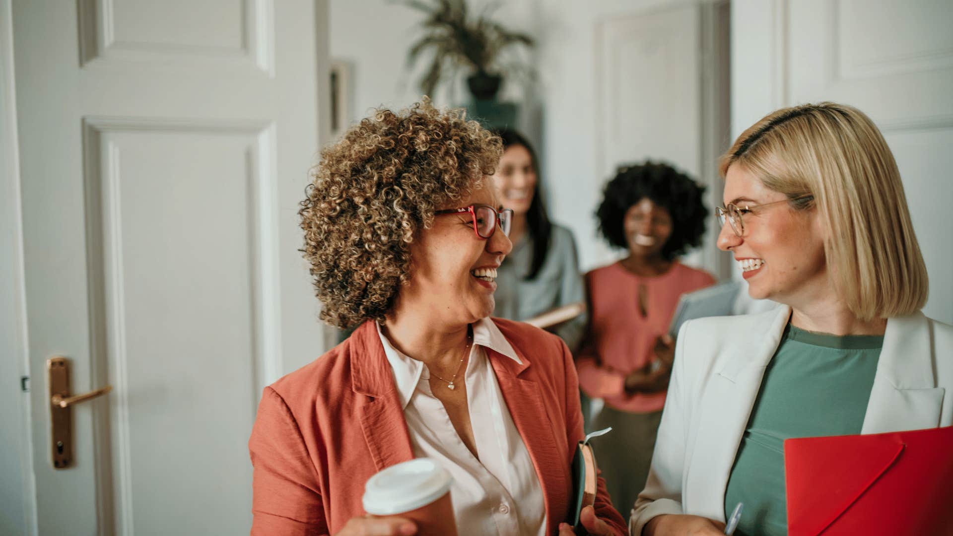 women talking and smiling to each other