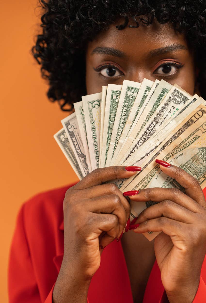 woman holding cash