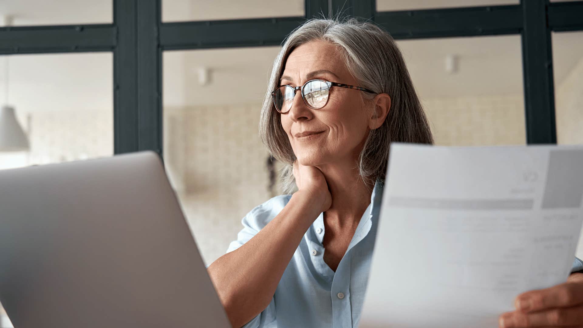 older woman working on laptop