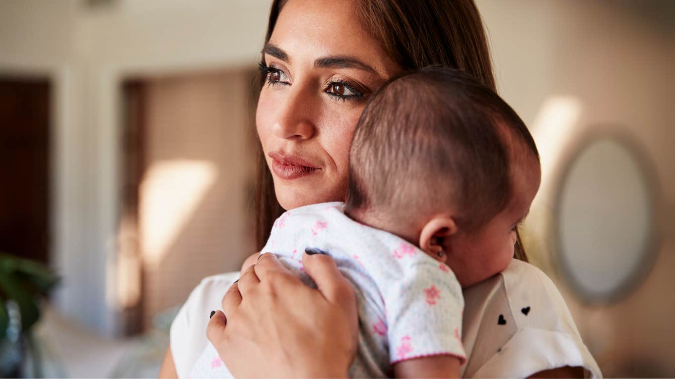 Mother holding her baby. 