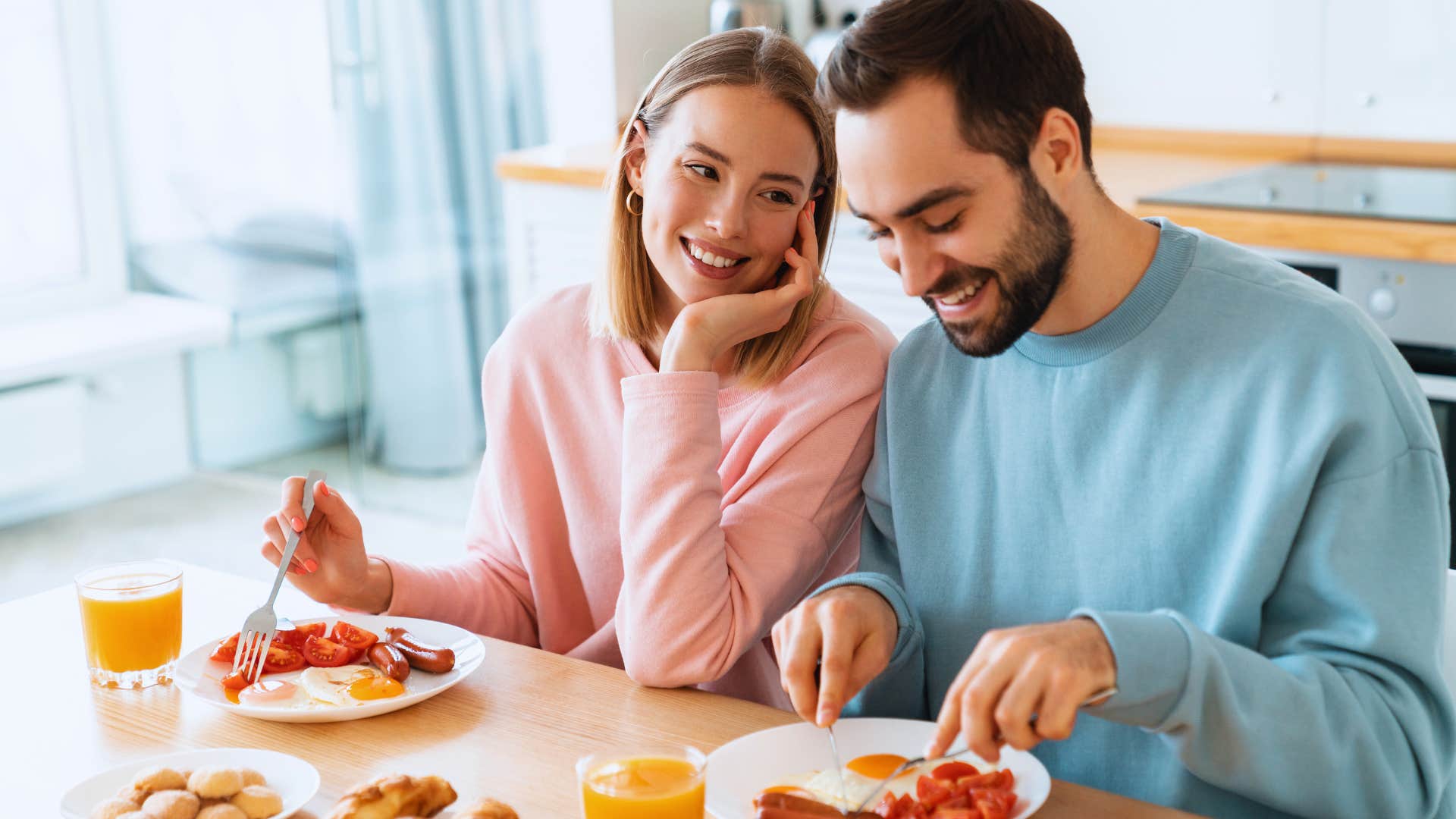 husband and wife having breakfast he made for her