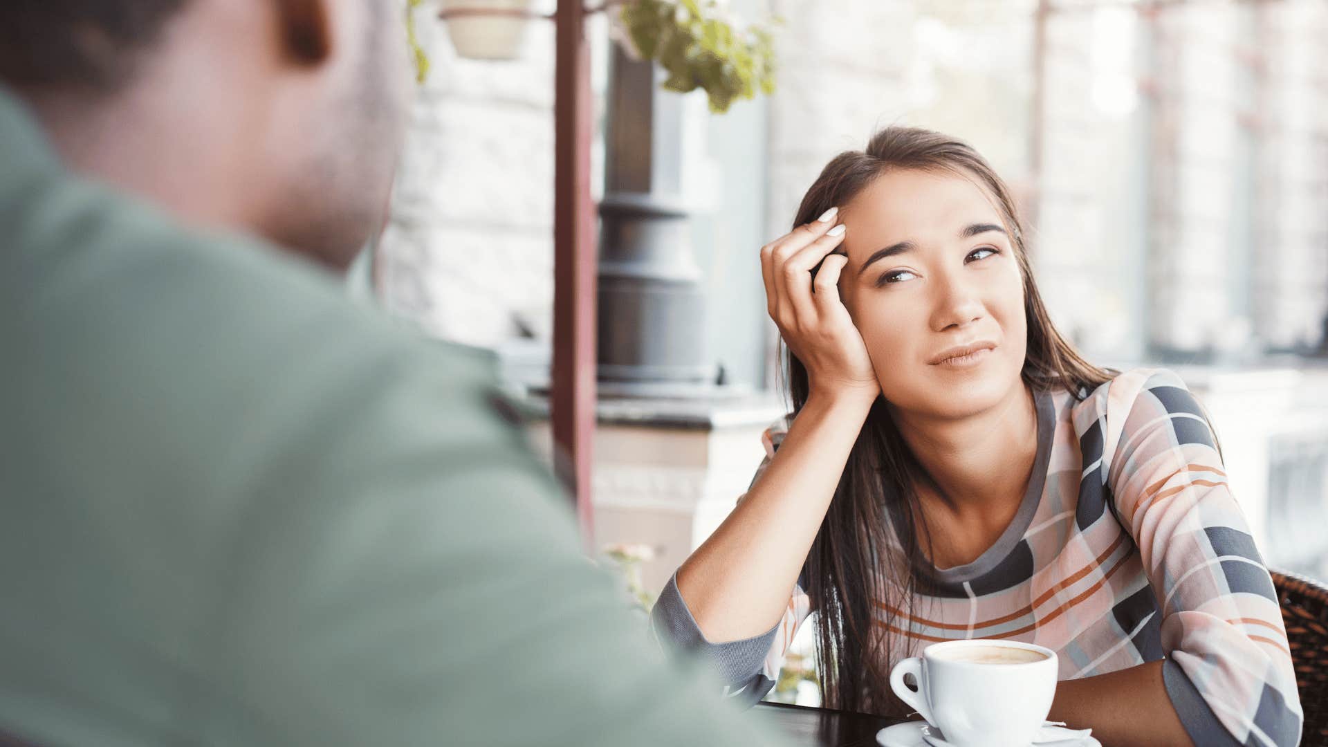 upset woman looking at man on date