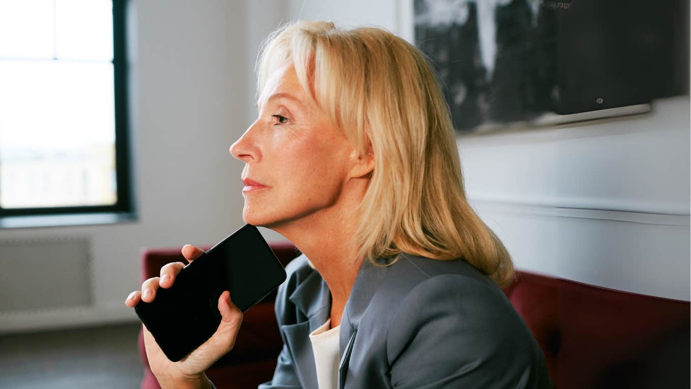 Woman waiting with phone after longtime friend shouted her.